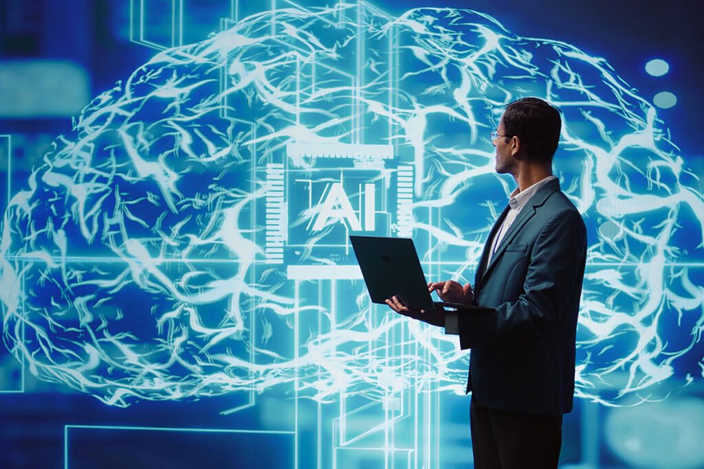 A man using a laptop in front of a glowing digital brain with AI connections, symbolizing artificial intelligence and innovation in technology.